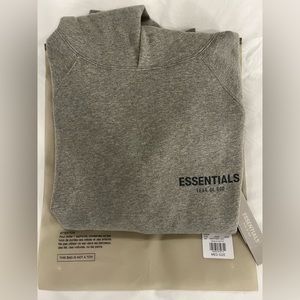 Brand new essentials hoodie in colour heather oat